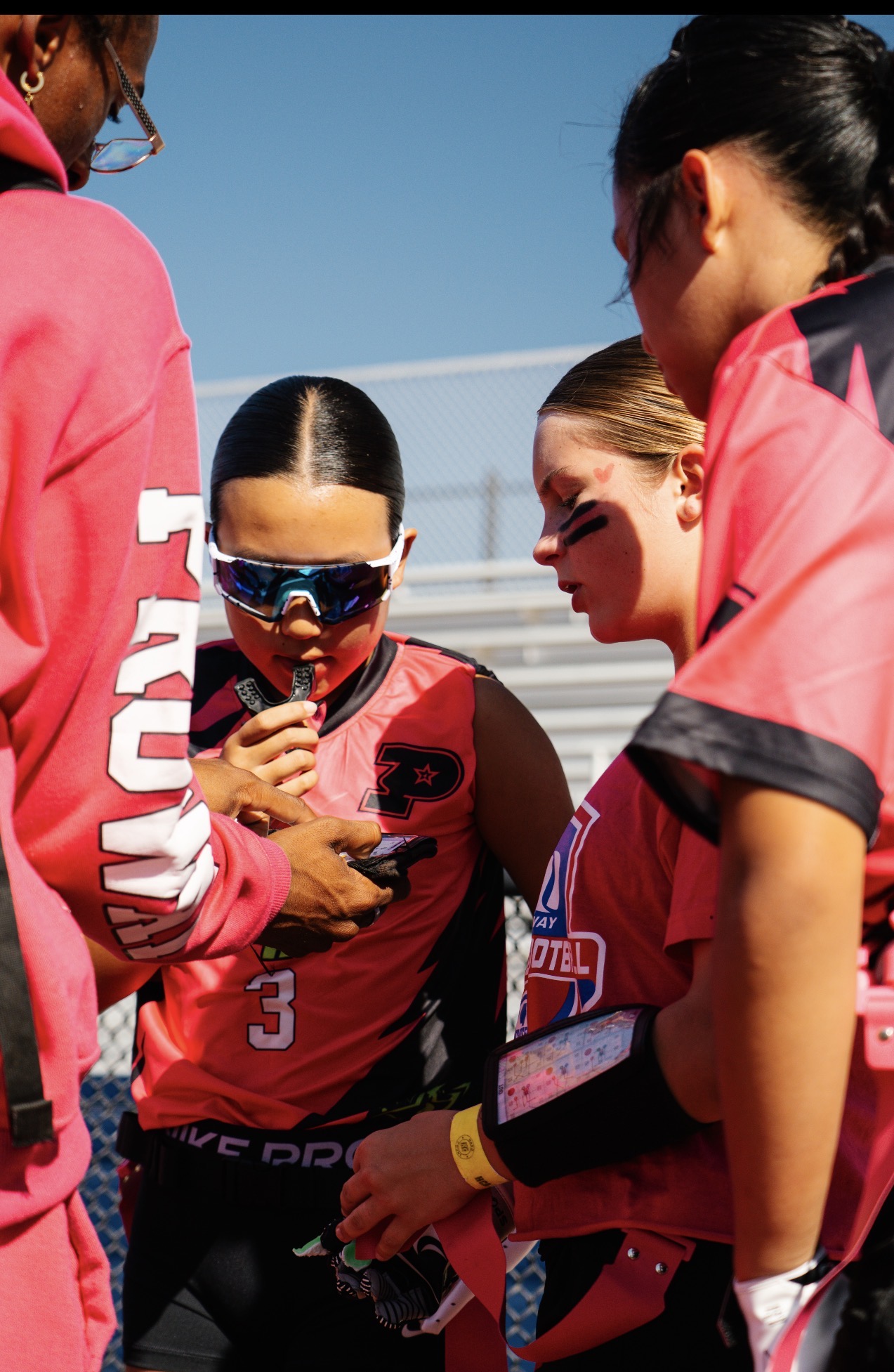 Proway players locked in together during a sideline huddle